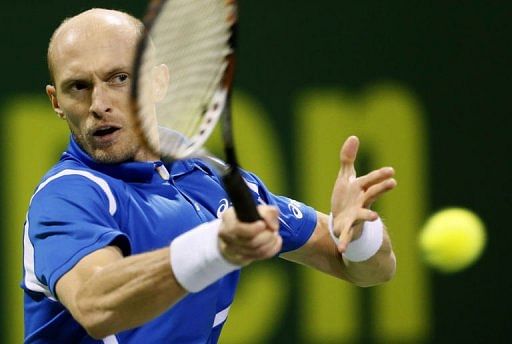 Top-seed Ferrer upset by forgotten man Davydenko