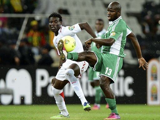 Traore strikes late to hold 10-man Nigeria