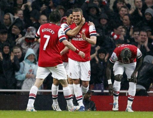 Podolski double condemns Wigan to relegation
