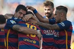 Barcelona lift La Liga title on final day thanks to a Luis Suarez hat-trick; Real Madrid settle for second