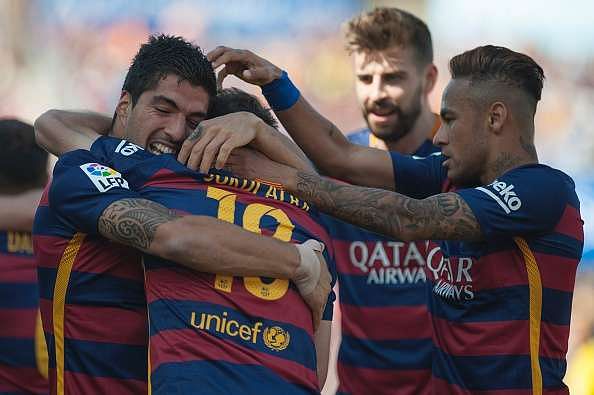 Barcelona lift La Liga title on final day thanks to a Luis Suarez hat-trick; Real Madrid settle for second