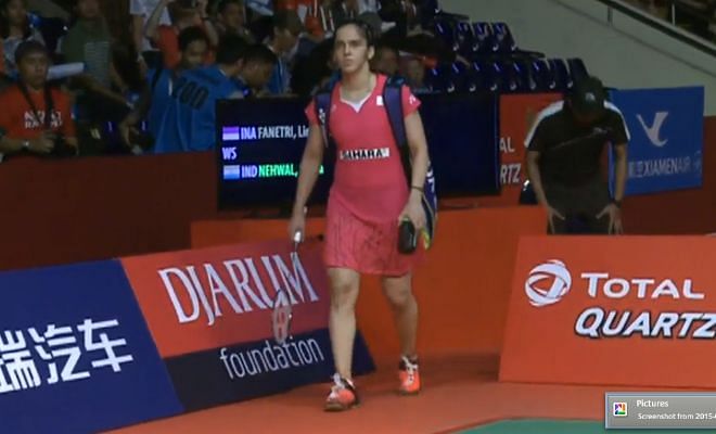 Saina Nehwal makes her way onto the court as she gets ready for her semifinal bout against Lindaweni Fanetri of Indonesia.
