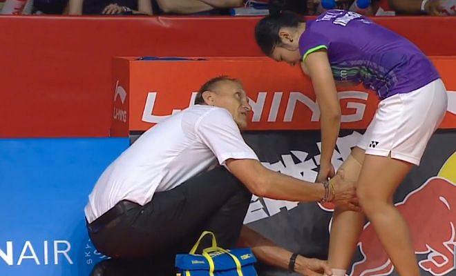 An injury as Fanetri is attended to by her physiotherapist after twisting her knee.