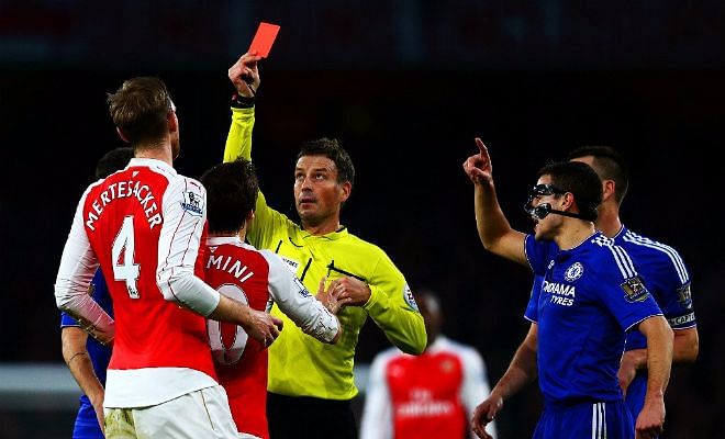 RED CARD! Mertesacker, who was the last man, brings down Diego Costa and is shown a direct red!