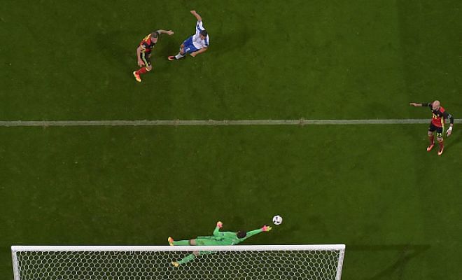 Here is fantastic image of Courtois' save.