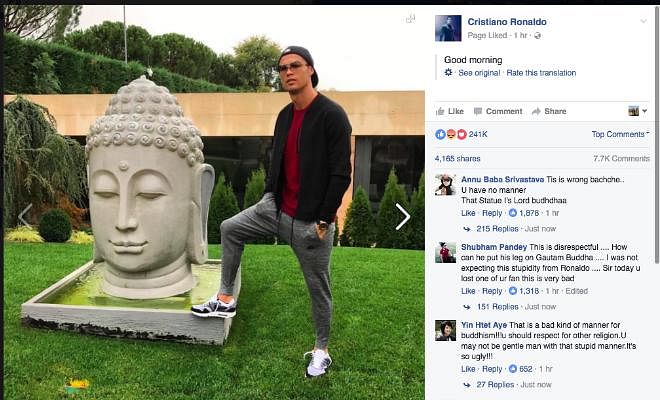 RONALDO LANDS HIMSELF IN CONTROVERSY Cristiano Ronaldo has posted a picture on facebook where he is seen keeping his feet in close proximity to a statue of The Buddha. This picture has allegedly offended a number of Buddhists, and Ronaldo's action was seen as a sign of disrespect. 