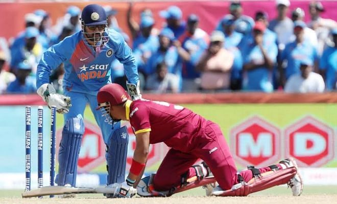 Ashwin slipped one down the leg side, and Dhoni effected a stumping to dismiss Simmons.