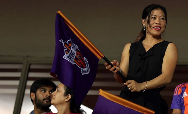 Indian boxing legend MC Mary Kom cheering on FC Pune City at the stadium.