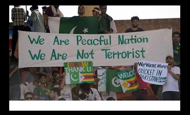 Pakistani supporter with a banner.