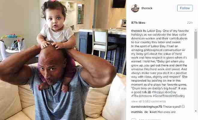 You'll fall in love with this photo of Dwayne Johnson and his baby girl on Instagram:Dwayne Johnson, better known to WWE fans as “The Rock”, posted a heartwarming picture with his nine-month-old daughter on the occasion of Labor Day. He even mentioned having a discussion with his daughter about putting in honest work for a living and to do what is positive with hard work and sweat. To this, The Rock’s daughter replied with ‘drum time on daddy’s head‘ and climbed on the head of the former WWE Champion.