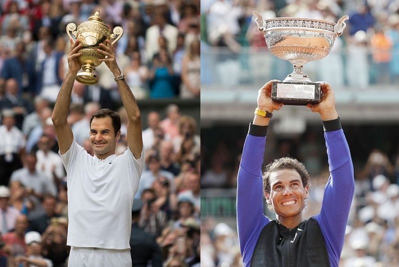 Roger Federer and Rafael Nadal with their Wimbledon and Roland Garros trophies