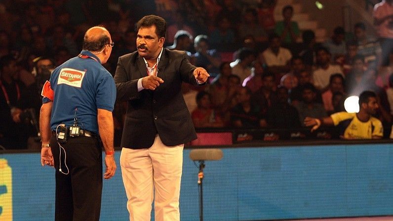 Coach Uday Kumar speaking to the referee during one of the PKL matches.