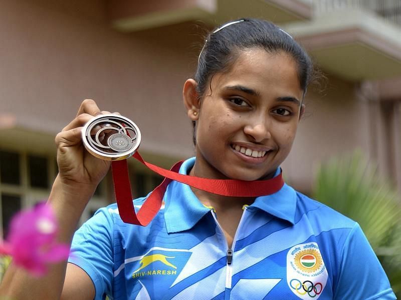 Dipa with the bronze medal she won in Glasgow 2014