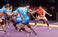 Ajay Thakur looks for a raid point against Bengal