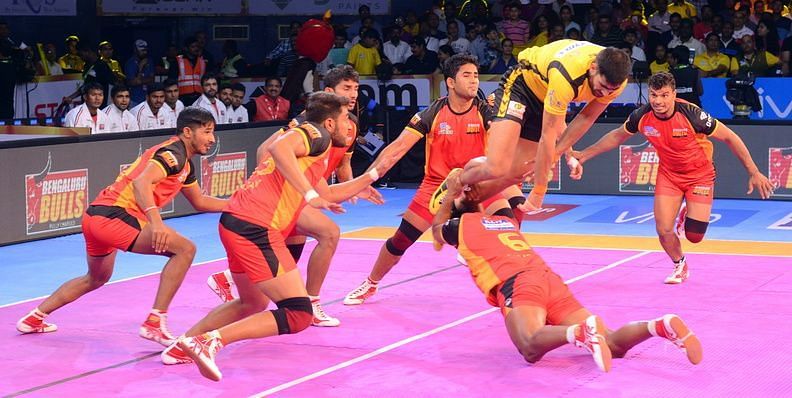 Rahul Chaudhari jumps past the Bengaluru defence.