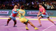 Amit Hooda enforces a body block on Rajesh Mondal of the Patna Pirates.