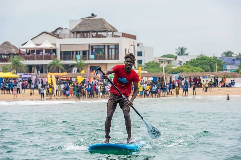 Sekar Petchai paddels up during a Stand- Up Paddling event