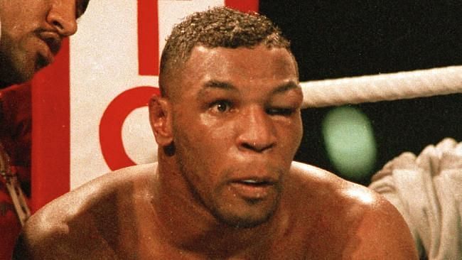 Mike Tyson (Right) looks on in disbelief after losing to Buster Douglas. 