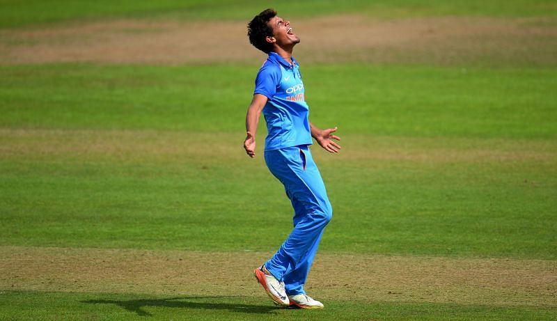 Rahul Chahar celebrates after taking a wicket