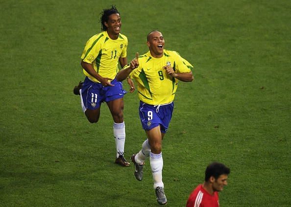 Ronaldo and Ronaldinho of Brazil celebrate  
