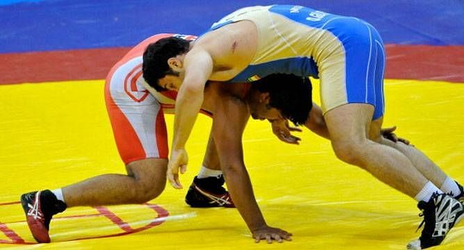 Naveen (left) was one of four Indian wrestlers who were in action today