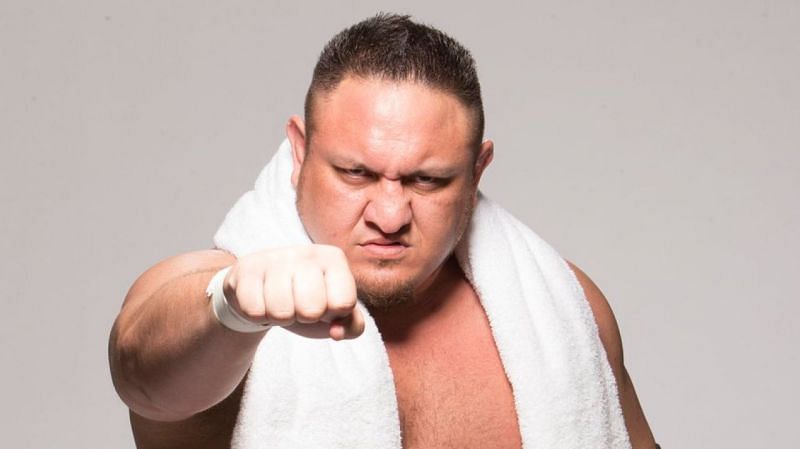 Samoa Joe is seen entering with a white towel around his neck
