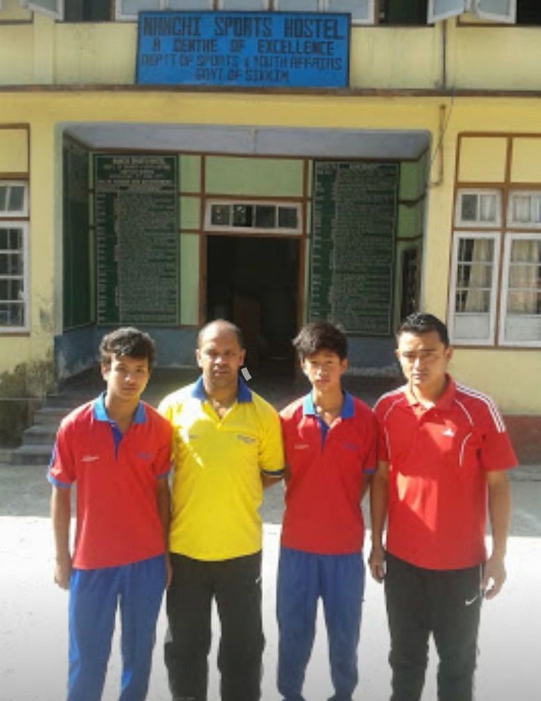 Komal (1st left) with his coach Suren Chettri (yellow shirt)