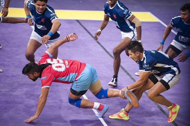Sandeep Dhull with a trademark ankle hold