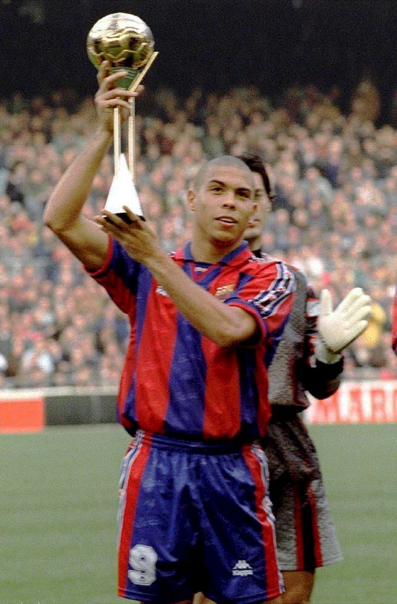 Ronaldo Nazario looks at his 2002 FIFA World Cup winners trophy