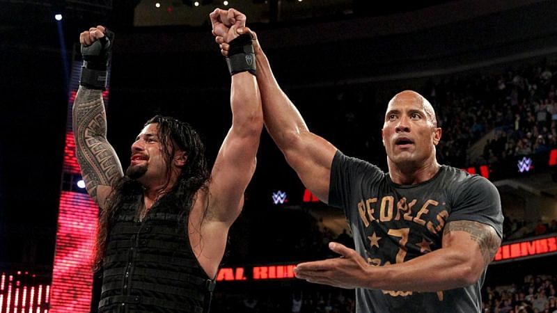 The Rock celebrates with Roman after Rumble win