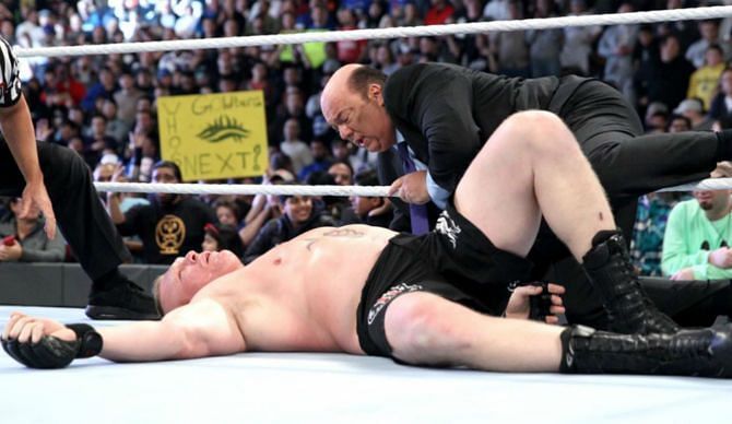 Brock Lesnar on the floor after losing to Goldberg at Survivor Series 2016