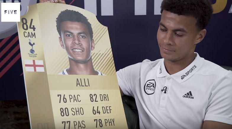 Dele Alli on Rio Ferdinand&#039;s YouTube channel, holding his rating card