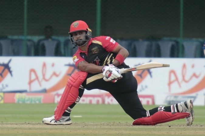 Stuart Binny attempts a sweep shot