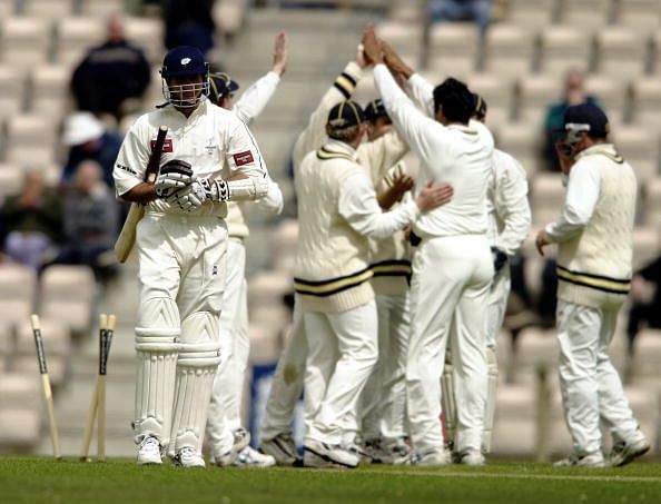 Michael Vaughan of Yorkshire walks back to the pavilion after being bowled by Wasim Akram of Hampshire