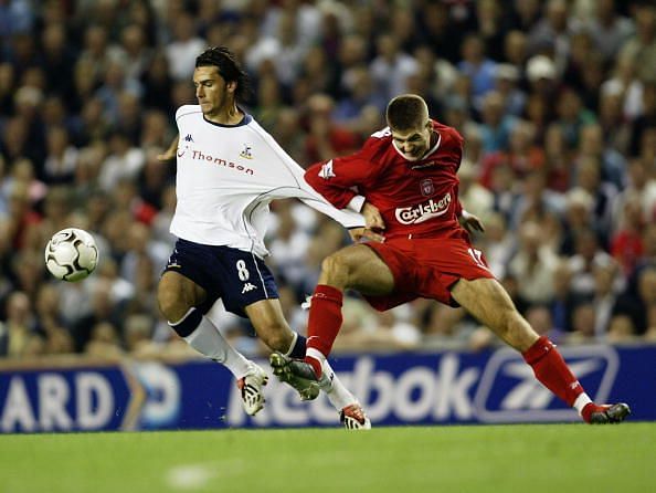 Helder Postiga of Tottenham Hotspur and Steven Gerrard of Liverpool