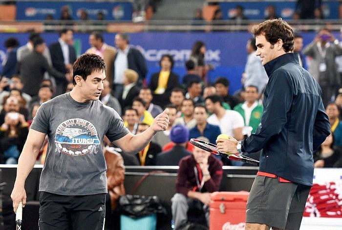 Aamir Khan is seen enjoying during a match with his favourite tennis player Roger Federer.