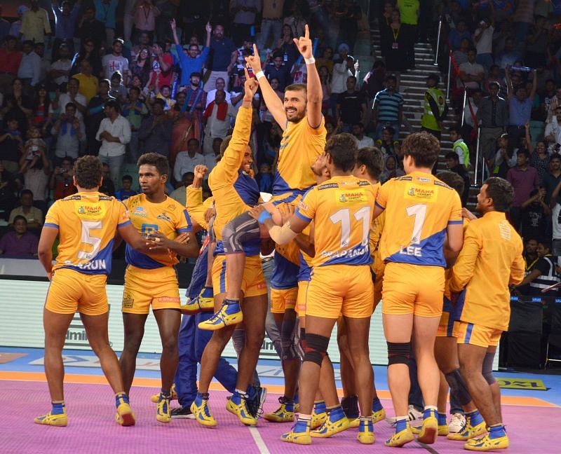Ajay Thakur is hoisted up by his teammates after his heroics in the final action of the game