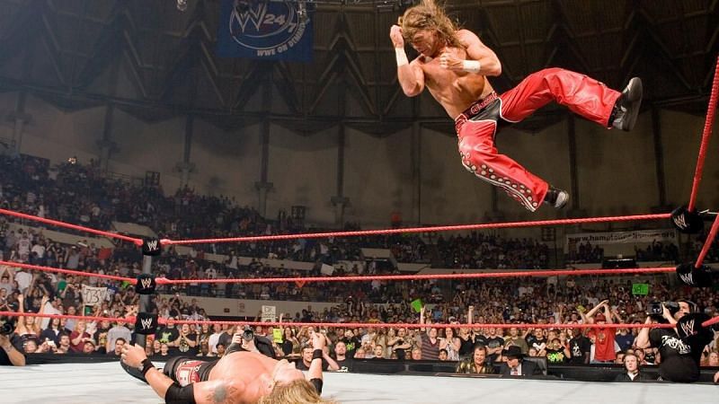 Shawn Michaels delivers an elbow drop to Edge