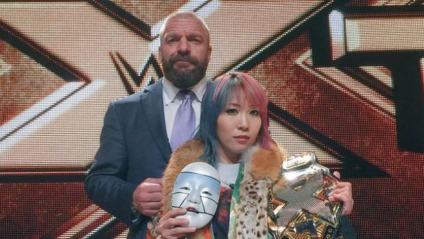 Triple H often gets photographed with up-and-coming talent backstage.
