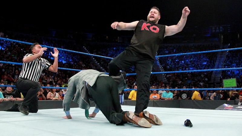 Kevin Owens viciously attacking Vince McMahon