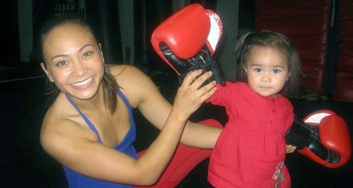 Michelle Waterson trains with her daughter at the Jackson-Wink facility in Albuquerque, New Mexico.