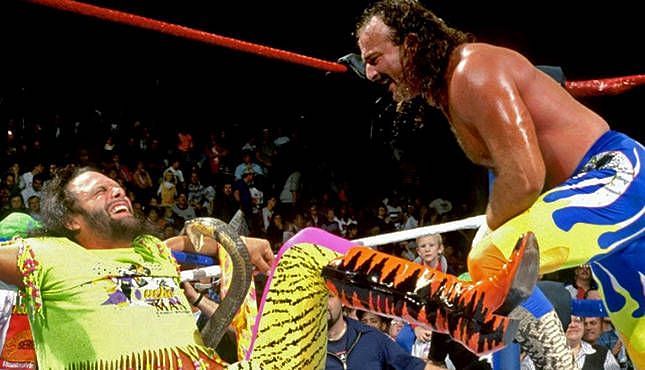 Jake Roberts ties Macho Man up in the ropes as he is bitten by Roberts&#039; cobra