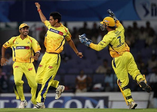 Tyagi celebrates with MS Dhoni and Suresh Raina after dismissing AB de Villiers in the 2009 IPL