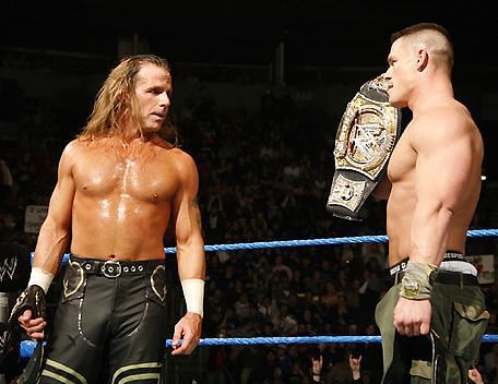 John Cena shows off his WWE Championship to Shawn Michaels
