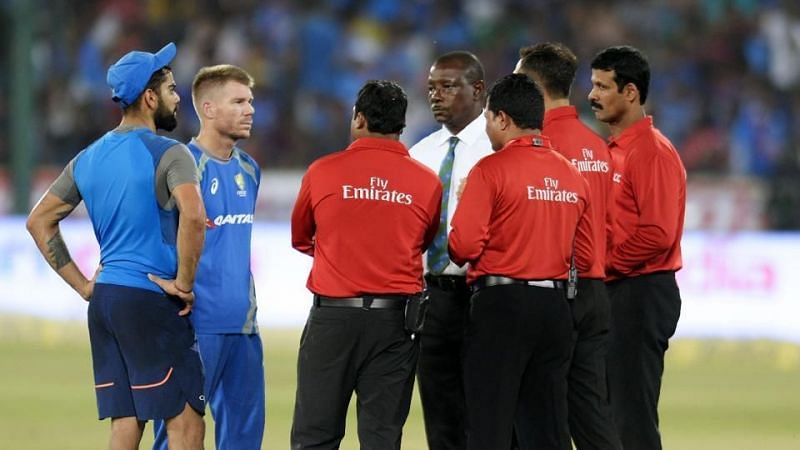 The two captains in discussion with the match officials. Photo credits - AFP
