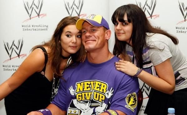 John Cena taking photos with female fans