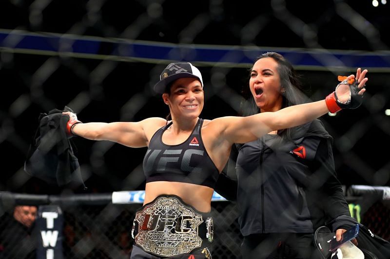 Amanda Nunes celebrating after her first title defense at UFC 207