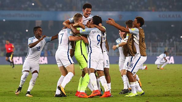 England players celebrating their shootout win over Japan