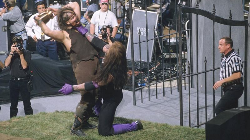 The Undertaker and Mankind battle at the makeshift gravesite in Indianapolis&#039;s Market Square Arena