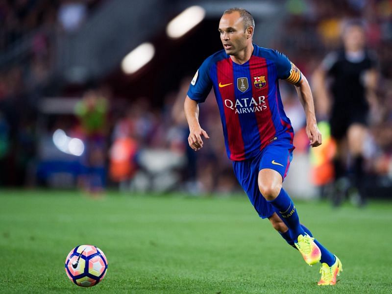 The Sorcerer; Andreas Iniesta stands side by side with the Big Two